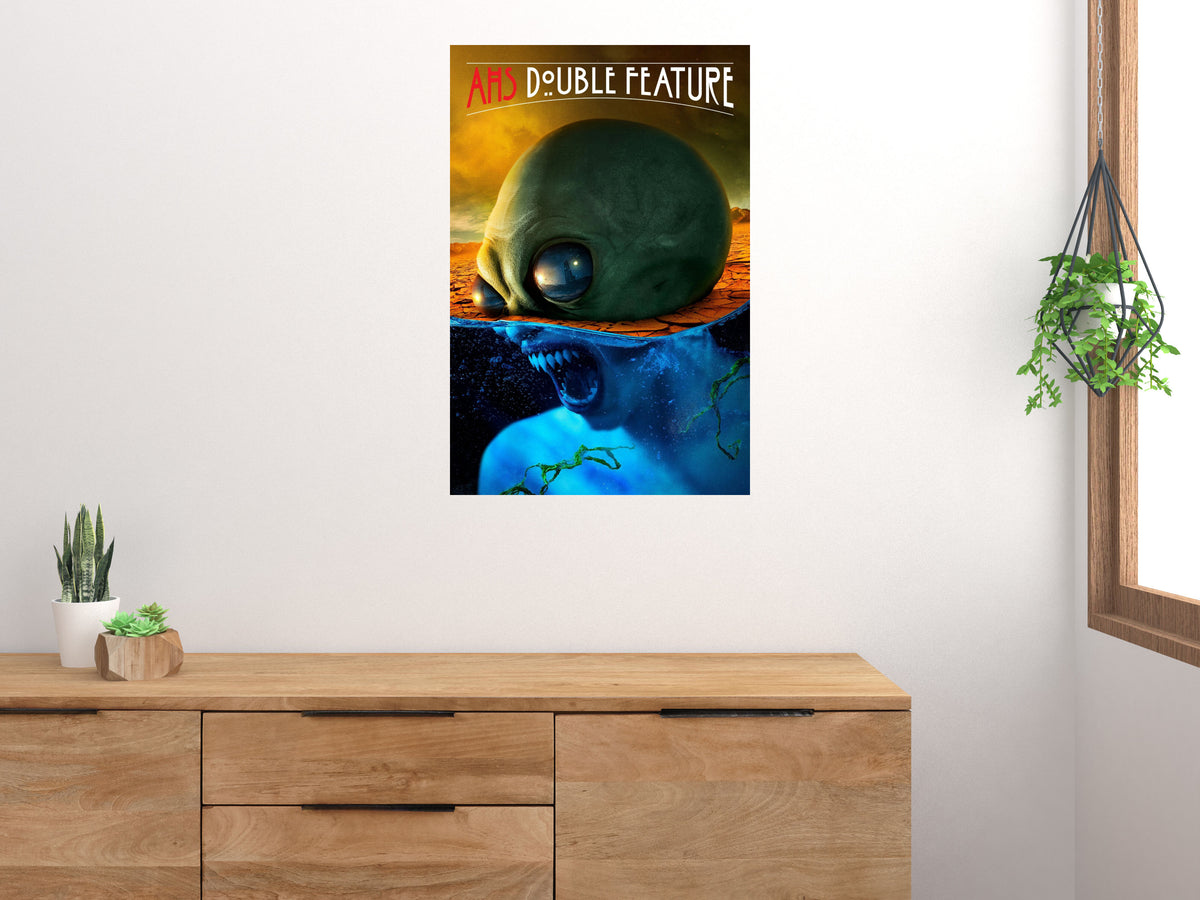 American Horror Story Double Feature poster displayed above a wooden cabinet on a white wall