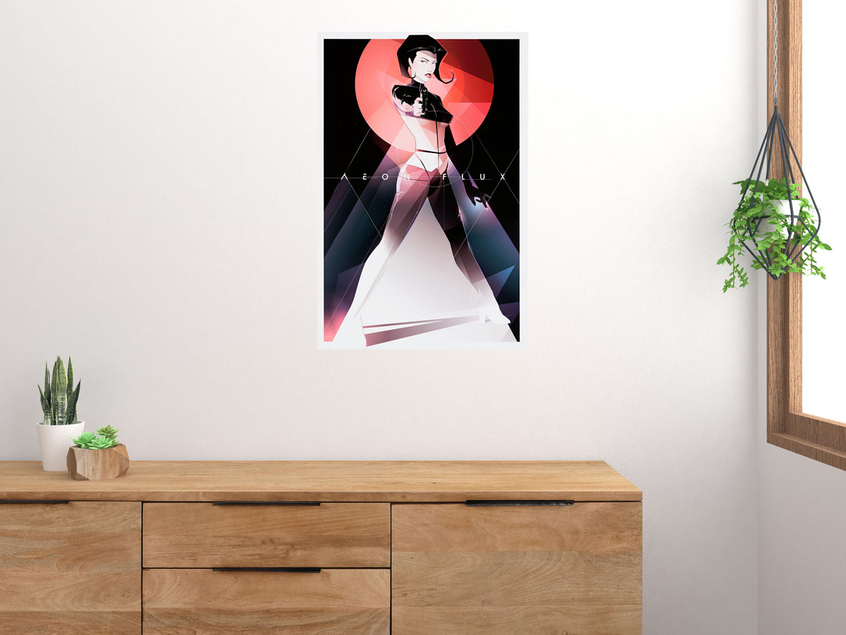 Aeon Flux poster displayed on a white wall above a wooden cabinet