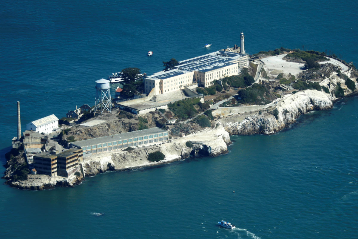 Alcatraz Island with prison buildings and surrounding water poster for sale
