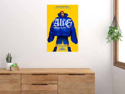 Ali G Who Iz I? poster displayed on a white wall above a wooden cabinet