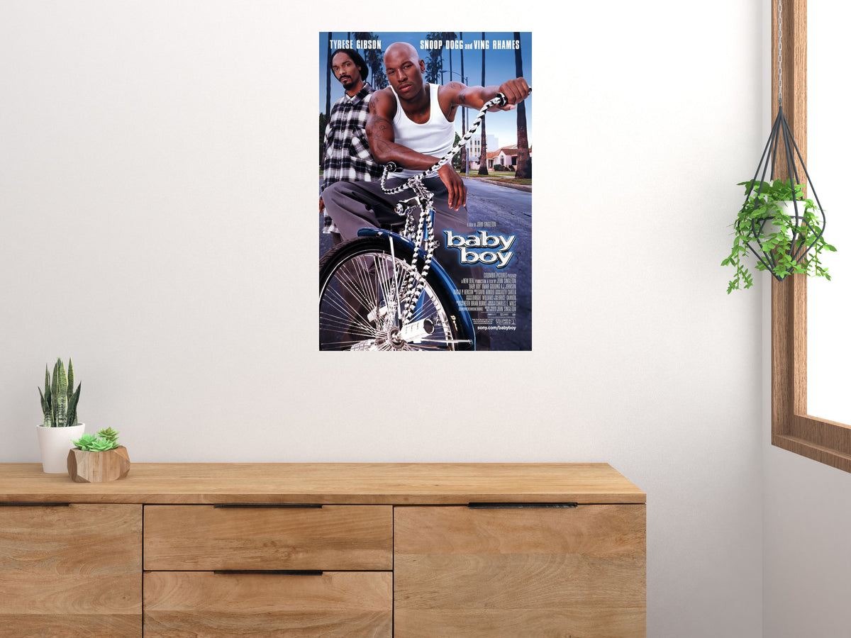 Baby Boy movie poster displayed on a white wall above a wooden cabinet