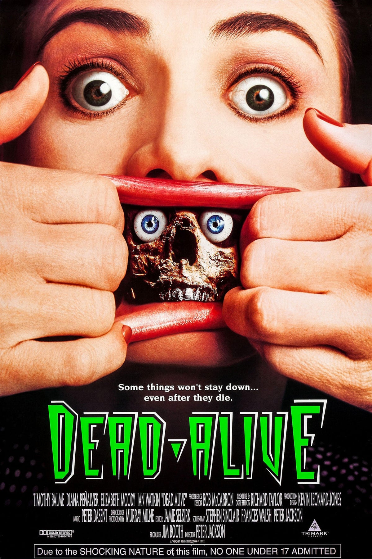 Dead Alive Braindead horror movie poster with a wide-eyed face, creature imagery, and green title lettering