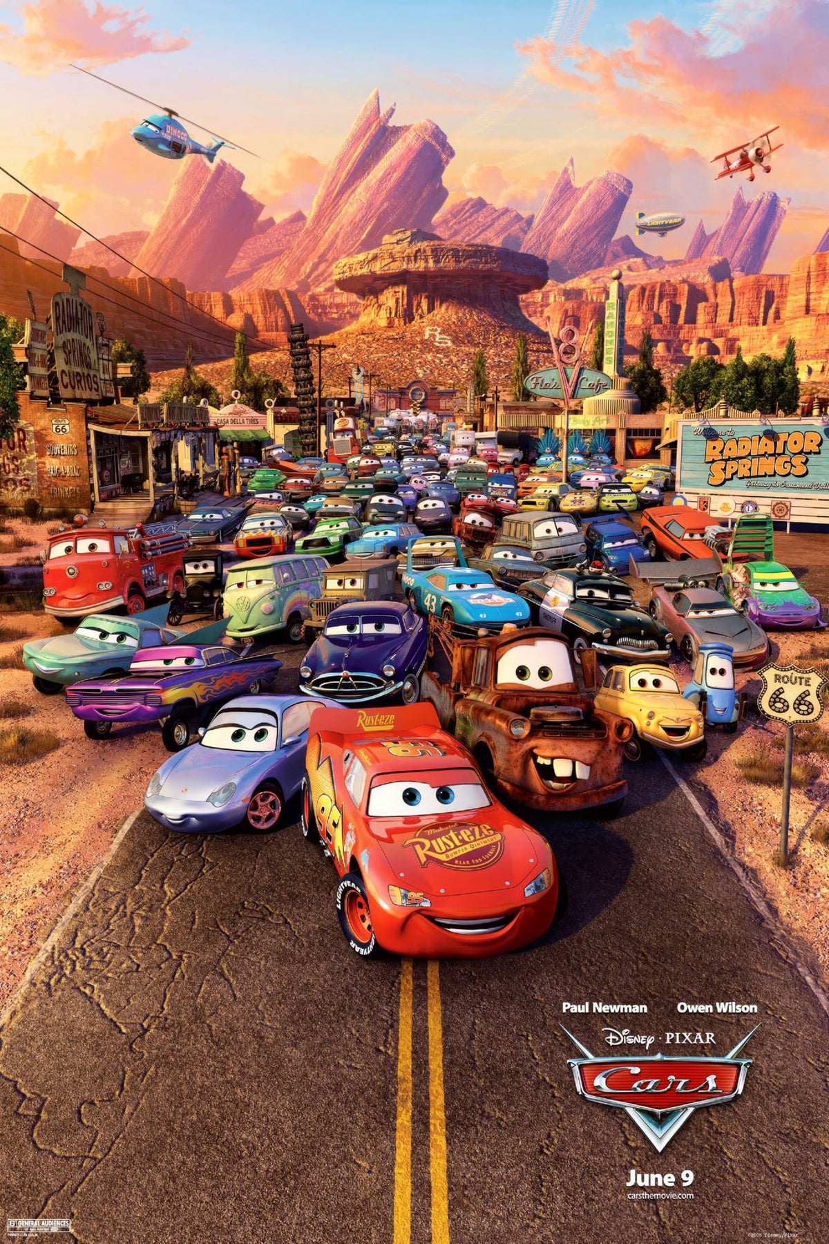 Cars movie poster featuring Lightning McQueen, Mater, Sally, and friends in Radiator Springs at sunset