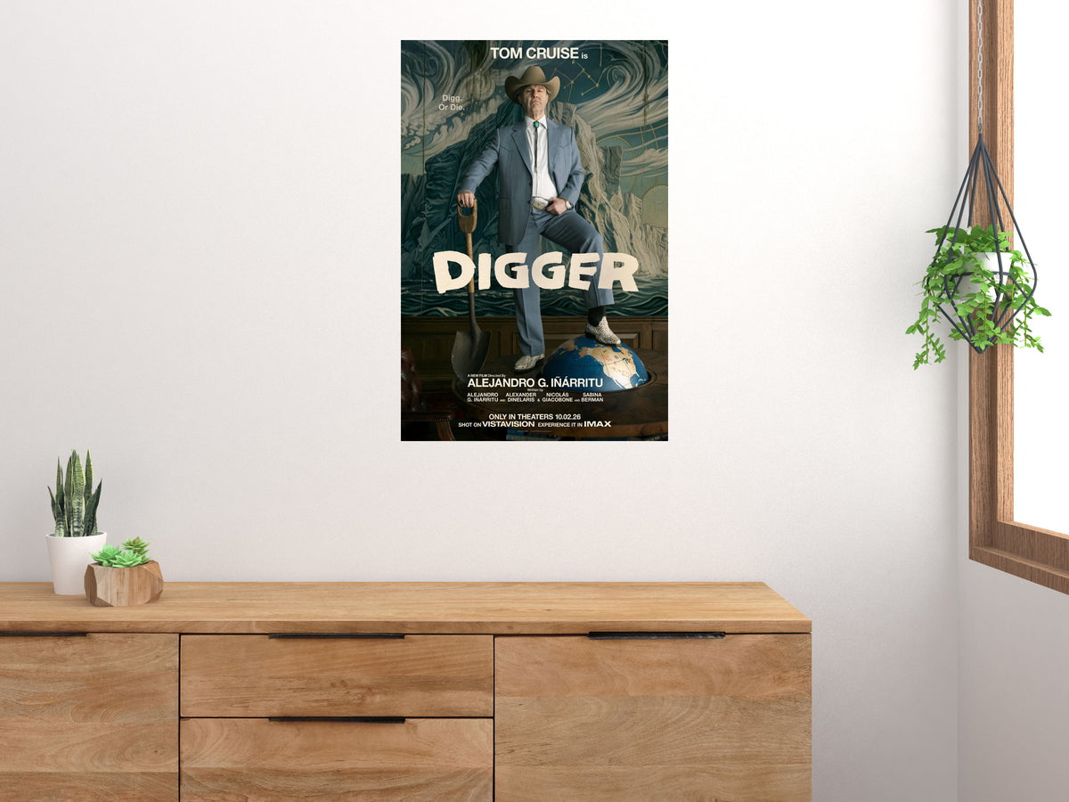 Digger shovel and globe movie poster displayed above a wooden sideboard beside houseplants