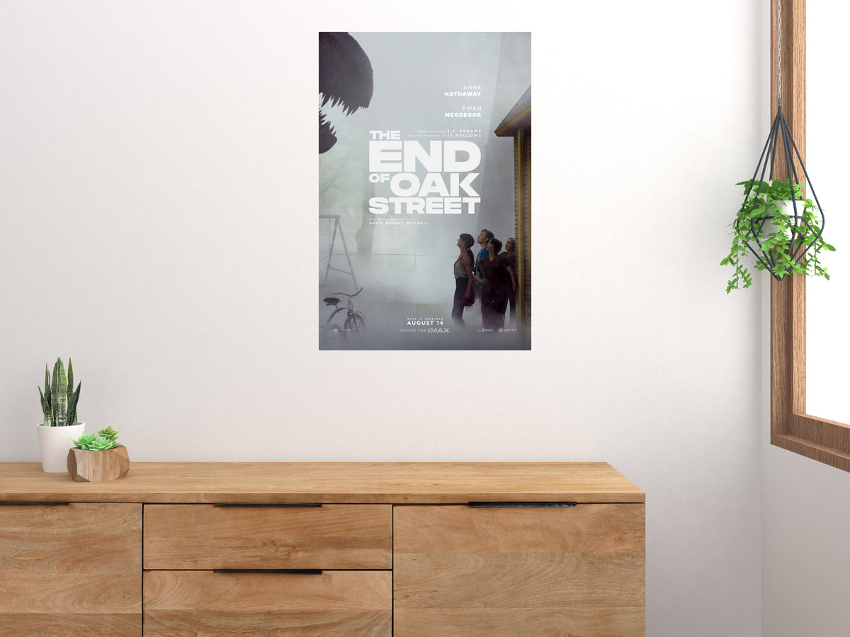 The End of Oak Street movie poster displayed above a wooden sideboard beside a window and houseplants