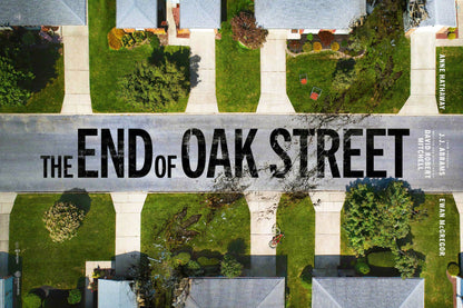 The End of Oak Street horizontal movie poster showing an aerial suburban neighborhood with green lawns, a damaged street and large black title lettering