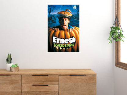 Ernest Scared Stupid vertical poster displayed on a light wall above a wooden cabinet