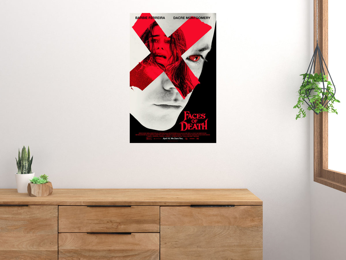 Faces of Death Red X vertical movie poster displayed on a light wall above a wooden cabinet