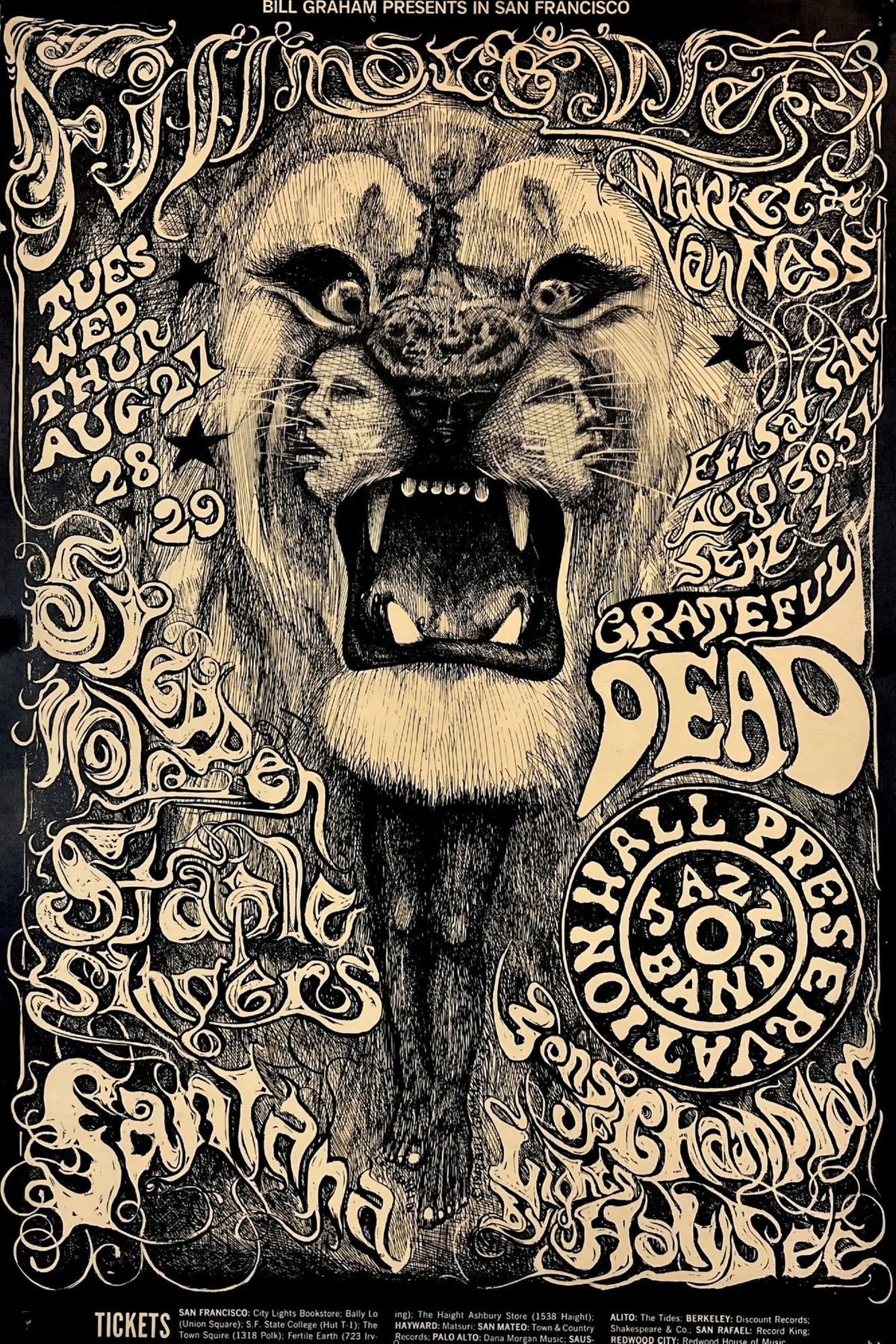 Fillmore West concert poster with a roaring lion and ornate cream psychedelic lettering on black