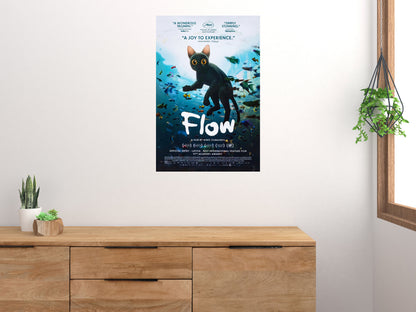 Vertical Flow black cat movie poster displayed above a wooden cabinet on a light wall