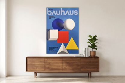 Lifestyle mockup of the Bauhaus geometric poster displayed above a walnut sideboard