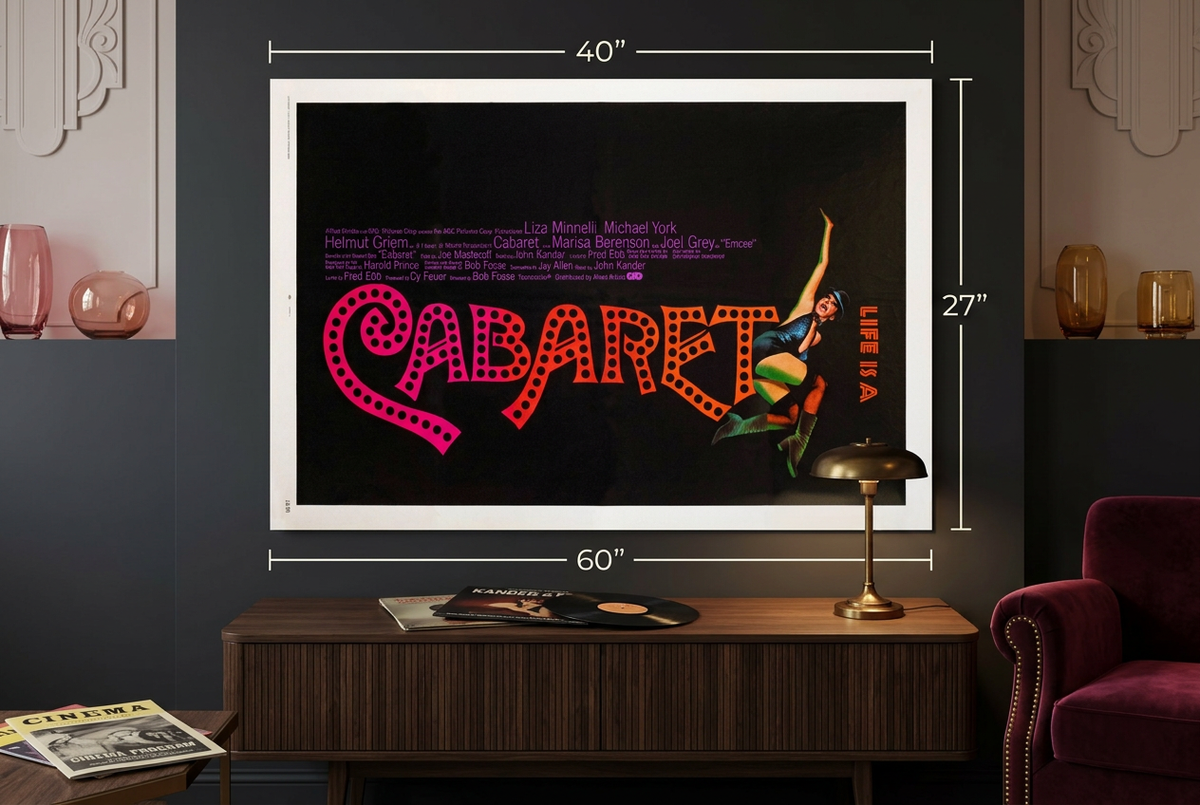 Horizontal Cabaret poster above a walnut console in a burgundy-and-brass musical cinema lounge