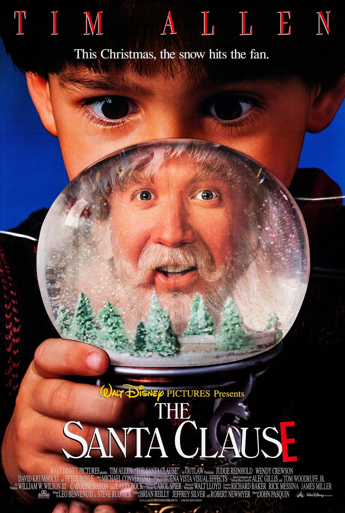The Santa Clause movie poster with snow globe artwork and snowy evergreen trees