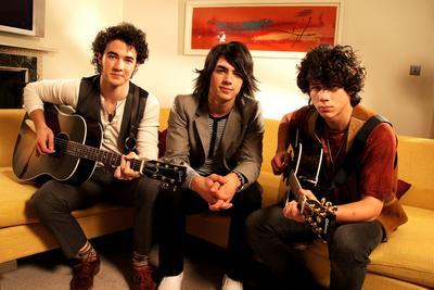 Jonas Brothers Couch Photo Sign 8in x 12in